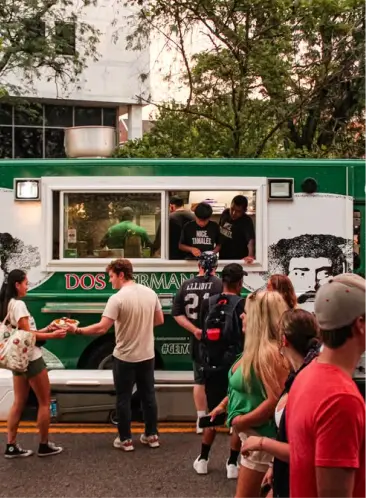 Dos Hermanos food truck serving customers